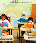 Children reading at desks with Watercolor Dots Desk Name Plates Set With 36 Confetti Style Name Tags For Desks visible.