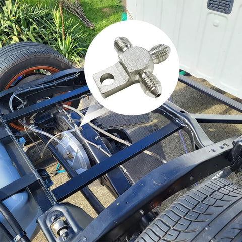 Installed KVAEY 3AN stainless steel brake line tee adapter with mounting tab and three male flare fittings