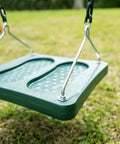 Green stand up swing for backyard playsets with 14x14 inch base coated chains pinch free design over grass