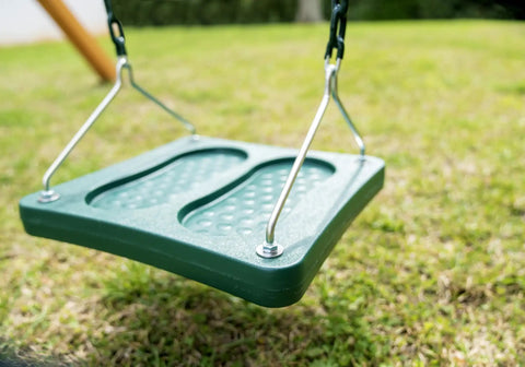 Green stand up swing for backyard playsets with 14x14 inch base coated chains pinch free design over grass