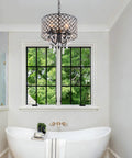 Bathroom scene with Black Crystal Chandelier Pendant Light Modern Drum Shade With Raindrop Crystals Four Light Hanging Fixture For Bedroom Kitchen Island Dining Room And Entryway Totally Lit Luxury Vibe hanging over a bathtub.