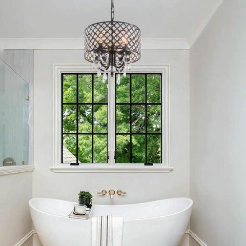 Bathroom scene with Black Crystal Chandelier Pendant Light Modern Drum Shade With Raindrop Crystals Four Light Hanging Fixture For Bedroom Kitchen Island Dining Room And Entryway Totally Lit Luxury Vibe hanging over a bathtub.
