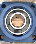 Thinking Process:. blue cast iron industrial bearing housing with sealed steel bearing, square flange mount