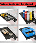 Foldable Magnetic Work Table For Packout System with tools, bottles, wires, and toolbox on black foldable surface