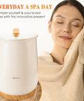 Woman enjoying cozy warmth with Ultra Large Bucket Towel Warmer For Bathroom With Auto Shut Off, fits oversized towels, white