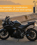 Two Pack Mini Bike Kickstand Springs 10cm Universal Replacement Side Kickstand Springs For Motorcycle Scooter Dirt Pit Bike Built Tough Steel Black Finish next to a parked motorcycle at sunset