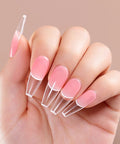 Hand with pink nail extensions using HEMA Free Builder Gel Kit With 6 Colors 15ml Each For Nail Extensions, UV LED Compatible