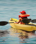 Compact 6.5 Ft Sit In Recreational Kayak With Paddle For One Person Easy Load Hard Shell Ocean Boat For Fishing And Family Fun Perfect For Small Paddlers And Calm Water Adventures, young paddler enjoying calm waters.