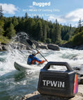 80W Portable Bluetooth Speaker With Big Bass And Rugged Outdoor Vibe, IPX6 Waterproof, on a rock by a river, kayak in background