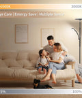 Family relaxing under a Torchiere Floor Lamp With Reading Light, 3500 Lumen LED Standing Lamp, 35W Energy Saver in living room.