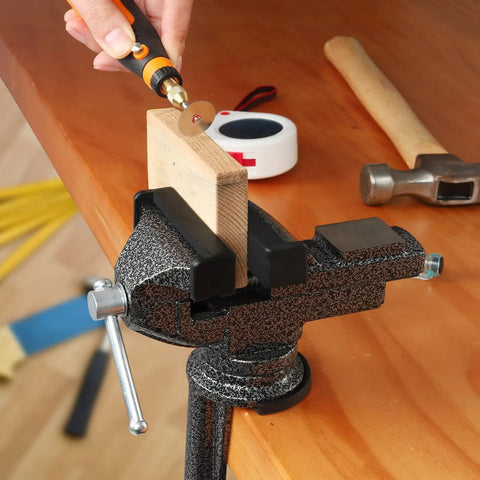 Universal Bench Vise Clamp On Tool With 3.15 Inch Jaw And 360 Degree Swivel Base used for cutting wood on a tabletop