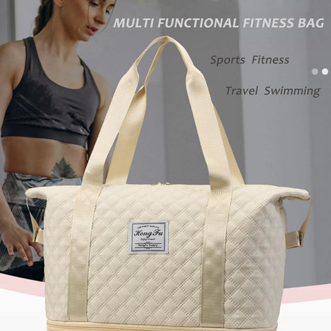Rolling duffle bag, front view: white quilted fabric with twin carrying handles and front brand patch.