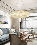 Curved Crystal Ceiling Pendant Light Ring LED Lamp Modern Home Decor Warm Glow Adjustable Wire Fixture in a stylish living room.