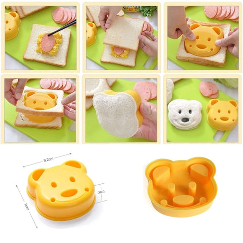 Bear-shaped yellow plastic bread cutter press for sandwiches; front view of Higoney toddler kitchen set