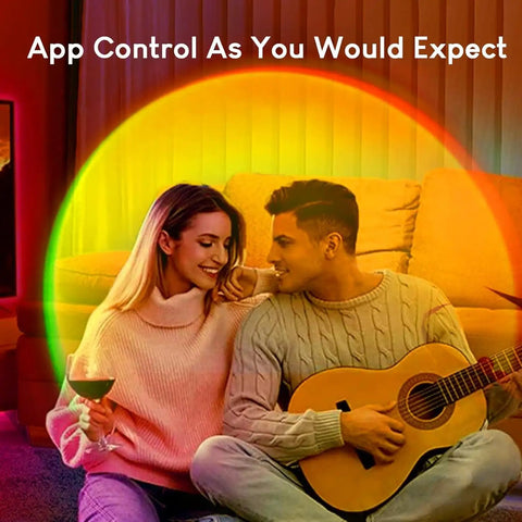 Couple enjoying Dope Glow LED Light Projector For Aesthetic Room Vibe, RGB Color Changing Night Light in cozy setting.