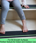 Child sitting on stairs with Anti Slip Tape With Glow In The Dark Stripe For Stairs Four Inch By Thirty Five Foot Waterproof Non Slip Grip Tape