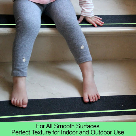 Child sitting on stairs with Anti Slip Tape With Glow In The Dark Stripe For Stairs Four Inch By Thirty Five Foot Waterproof Non Slip Grip Tape