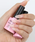 Hand holding Builder Base Clear Gel Kit For Nails Sheer Color Gel Reinforcement Lacquer Hema Free Cruelty Free Vegan No Slip Solution