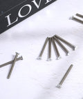 Fix Wonky Outlets Fast With These Extra Long Machine Screws Forty Pack White Painted Flat Head Wall Plate Fasteners 6 32 Thread One Point Five Inch, showing screws on white surface.