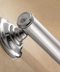 Close-up of a 16 Inch Chrome Bathroom Grab Bar With Comfort Grip Pad mounted on a wall, highlighting no-slip stability features.