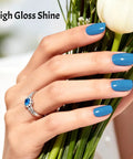 Woman's hand with blue nails from 36Pcs Gel Nail Polish Kit With 32 Classic Colors And 4 Essential Addons Base Coat No Wipe Top Coat