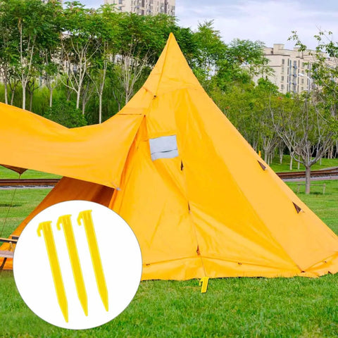 Heavy Duty Plastic Tent Stakes 10 Pack For Camping shown securing a bright yellow tent on grassy lawn
