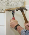 Lightweight Trim Puller Mini Multi Tool For Tight Spaces used to remove baseboard with hammer in home renovation
