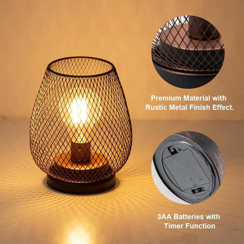 Set Of 4 Battery Operated LED Table Lanterns In Rustic Brown Metal Cage, bulb glowing in metal cage with battery compartment details.