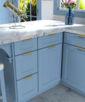 Elegant kitchen with blue cabinets featuring Five Pack Finger Edge Pulls For Gold Cabinet Hardware And Drawer Handles, installed view.