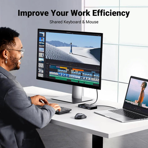 Two In Four Out USB 3.0 Switcher for Two Computers with Four Shared USB Ports on desk setup with monitor and laptop