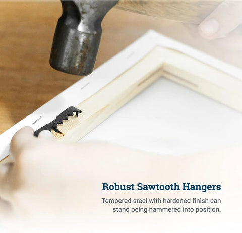 Sawtooth Picture Hangers Set, 150 Pack With 300 Screws being hammered into a wooden frame, demonstrating installation.
