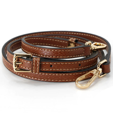 Hella Sturdy Adjustable Cowhide Leather Shoulder Strap Kit With Vintage Gold Hardware Game Changer For Mini Purse Easy Punch Free Installation Brown And Gold Crossbody Converter, showing a close-up of the brown leather strap with gold clasps.