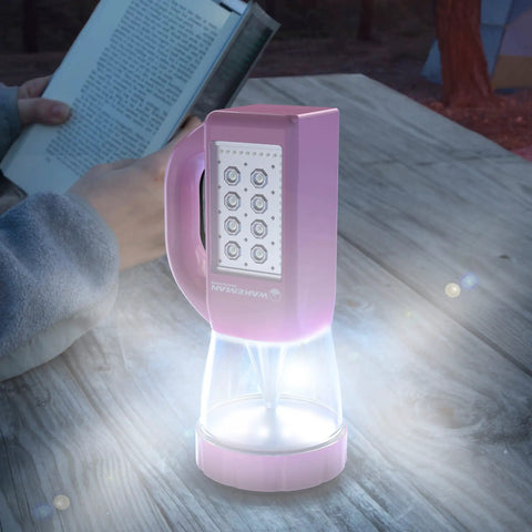 Three In One LED Lantern For Camping And Emergencies Ultra Compact And Lightweight Light on picnic table with person reading