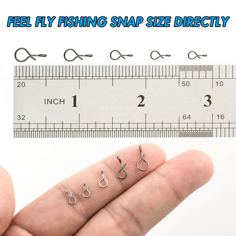 Comparing sizes of stainless steel quick change fly fishing snaps with a ruler for the 150 piece box, 5 sizes variety.