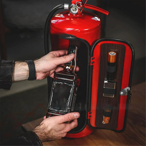Person placing a whiskey bottle inside the Fire Extinguisher Mini Bar With Concealed Liquor Cabinet To Stash Your Top Shelf Booze.