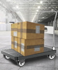 Heavy Duty Furniture Castor Wheels With Dual Locking Spinners And Smooth Polyurethane Tread Four Pack on a cart with boxes.