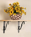 Heavy Duty 10 Pack L Shaped Shelf Brackets Wall Mounted Decorative Floating Shelf Hardware Kit With Screws And Anchors supporting a wooden shelf with sunflowers.