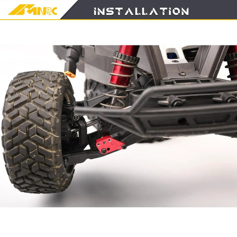 Close-up of Front And Rear Shock Mount Plate Towers Heighten Kit installation on Maxx RC Truck with red shocks.