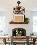 Caged Ceiling Fan With Light 21 Inch Rustic Dope Flush Mount in living room, visible above dining table with remote, 3 speeds.