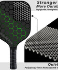 Close-up of a fiberglass pickleball paddle with hexagonal design from the All In One Pickleball Gear Kit with 4 Fiberglass Graphite Paddles, 2 Outdoor Balls, 2 Indoor Balls, Lead Tapes, Bag, and Essentials for Beginners to Pros, USAPA Approved for Men, Women, Kids, Adults