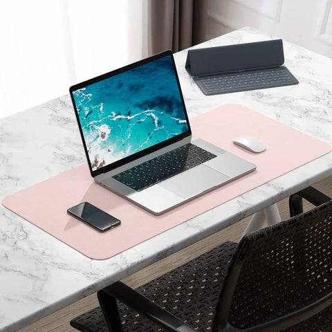 Pink Desk Pad 30x14 Inch PU Leather Desk Mat Waterproof Non Slip Ultra Thin XL Extended Mouse Pad on desk with laptop
