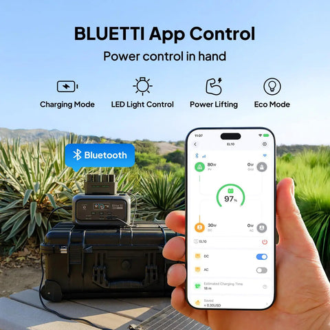 Person holding smartphone with app controlling Elite 10 Mini Portable Power Station 128Wh LiFePO4 Battery in outdoor setting.