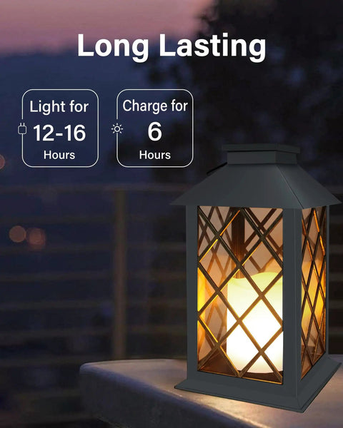 Solar Outdoor Lanterns Waterproof 14 Inch Two Pack With LED Flickering Flameless Candles on patio table at sunset.