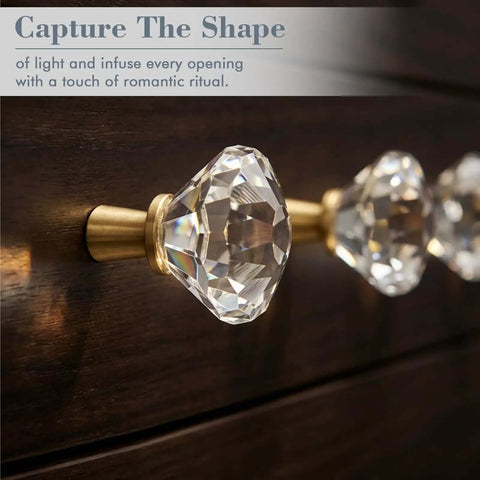 Close-up of 6 Pack Gold Tapered Diamond Cabinet Knobs With Clear Crystal Tops on dark wood dresser