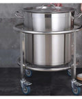 Kickass Heavy Duty Drum Rack And Commercial Soup Pot Trolley For Rolling 50 Cm Adjustable Barrels With Sturdy Steel Build, featuring a stainless steel pot with lid.