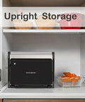 Multi Purpose Compact Contact Grill Sandwich Maker Panini Press With Floating Hinge Non Stick Plates stored upright in a kitchen cabinet.
