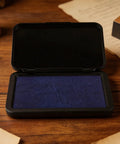 Dead Zero Smudge Fast Dry Pigment Ink Pad For Rubber Stamps And Official Signatures in open black case with blue ink.