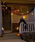 Porch decorated with 24 Pack Flameless Taper Candles With LED Flicker, 6.5 Inch Warm Yellow Dripless Candlesticks for Halloween Decor