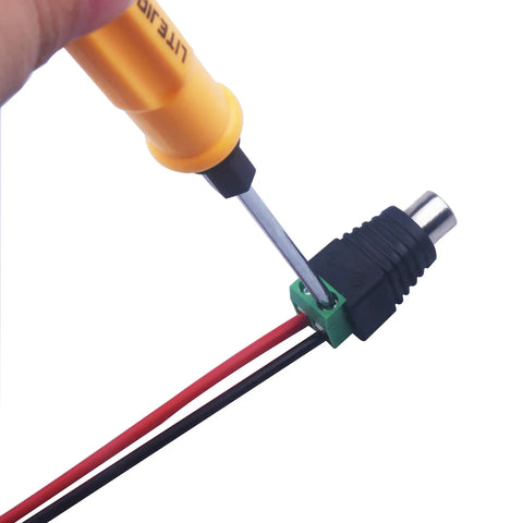Installation of Smooth As Butter Rca To Av Screw Terminal Connector with a screwdriver, showing red and black wires.