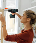 Woman using Tough As Nails 410 Stainless Steel Self Tapping Screws Heavy Duty Phillips Head for furniture assembly.